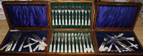 A set of twelve mother of pearl handles knives and forks, and two sets of six ditto, all oak cased